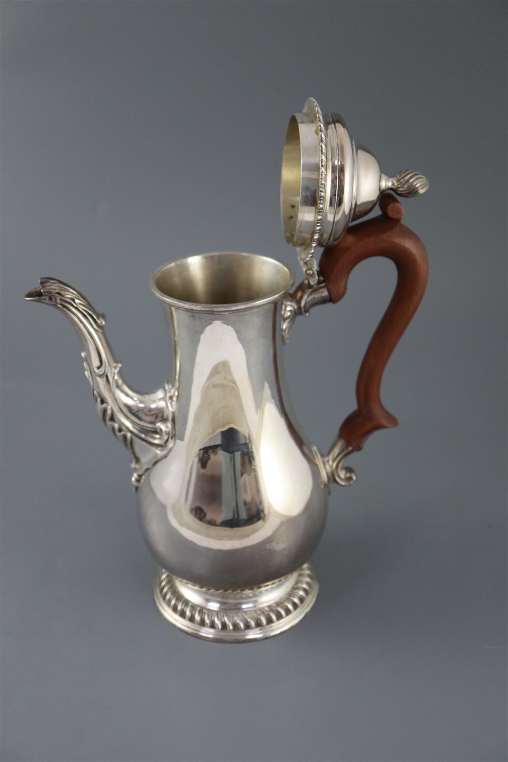 A modern 18th century style silver baluster coffee pot, by Spink & Son, gross 36oz.